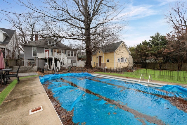 view of swimming pool with a deck