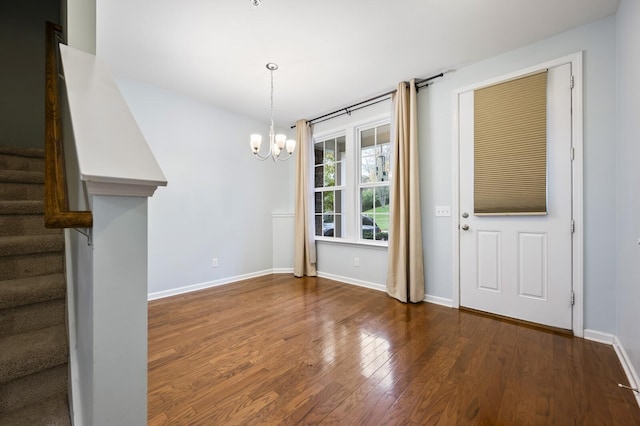 interior space featuring dark hardwood / wood-style floors and a chandelier