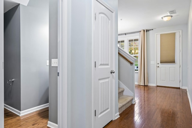 hallway with dark wood-type flooring