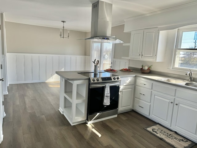 kitchen with white cabinetry, kitchen peninsula, island exhaust hood, and stainless steel range with electric stovetop