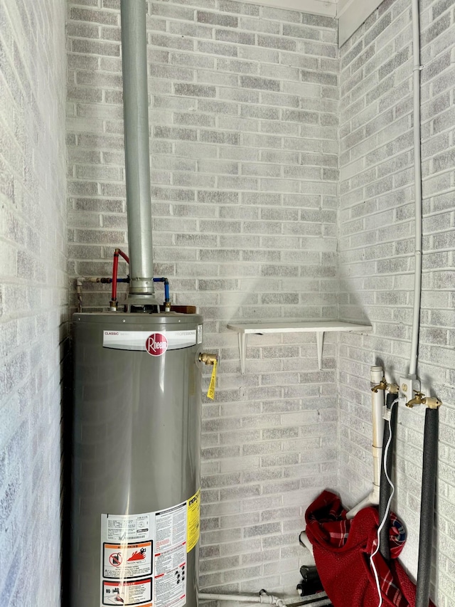 utility room featuring gas water heater