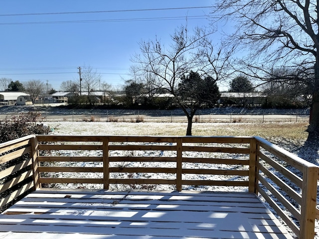 view of snow covered deck