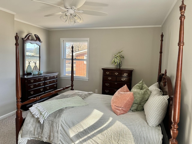 bedroom featuring ceiling fan, ornamental molding, and carpet floors