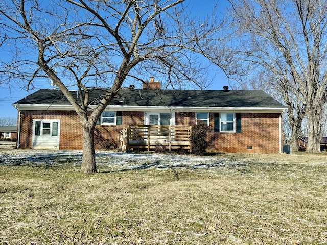 back of house with a wooden deck and a yard