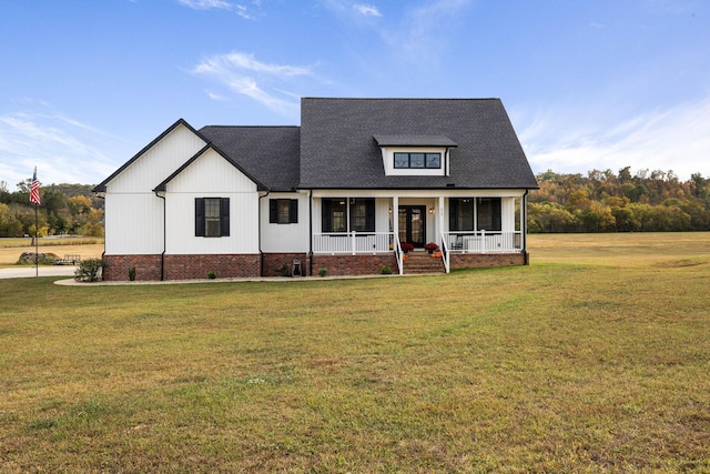 modern farmhouse featuring a front lawn and a porch