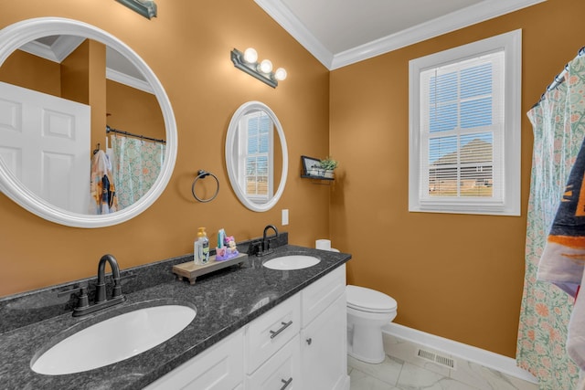 bathroom with toilet, ornamental molding, plenty of natural light, and vanity