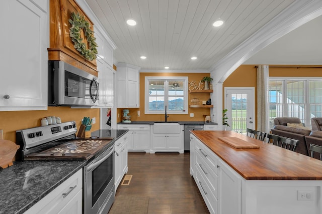 kitchen featuring wooden ceiling, stainless steel appliances, dark hardwood / wood-style flooring, crown molding, and sink