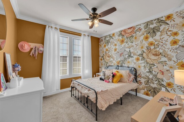 carpeted bedroom featuring ceiling fan and ornamental molding