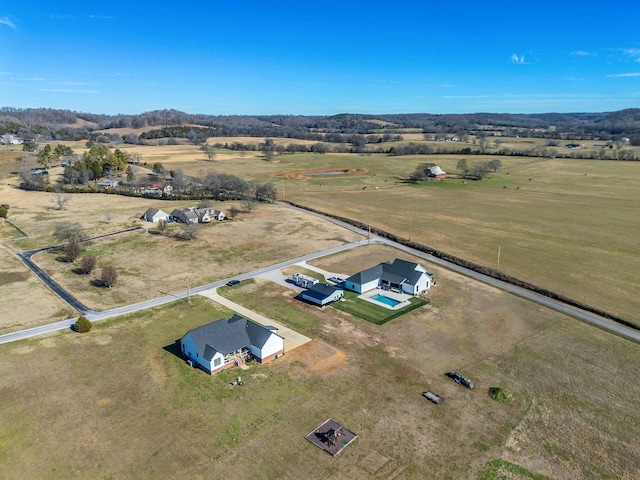 birds eye view of property featuring a rural view