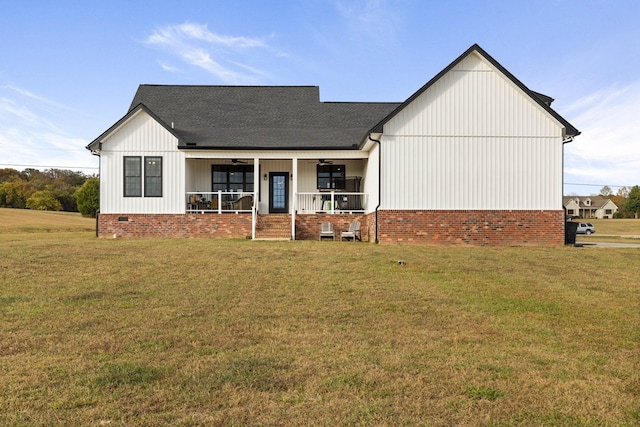 modern farmhouse with covered porch and a front lawn