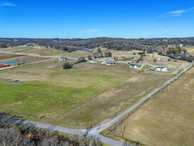 birds eye view of property featuring a rural view