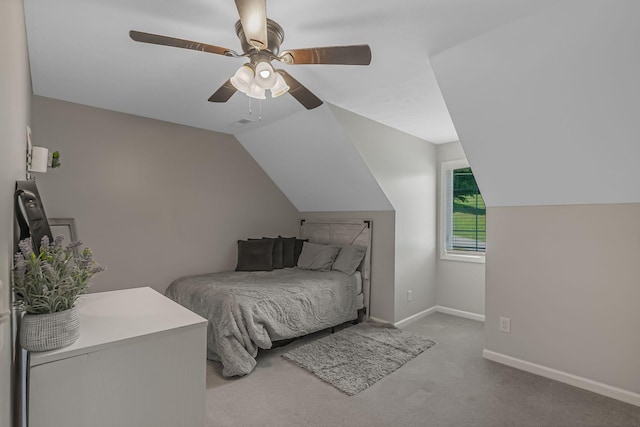 carpeted bedroom featuring ceiling fan and vaulted ceiling