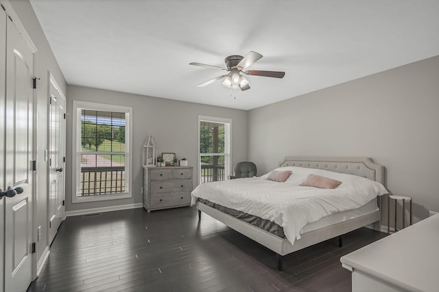 bedroom with dark wood-type flooring and ceiling fan