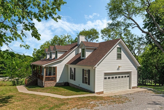 view of property exterior with a yard, a porch, and a garage