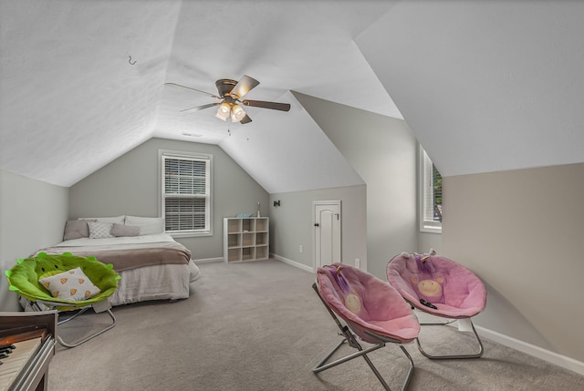 carpeted bedroom featuring ceiling fan and vaulted ceiling