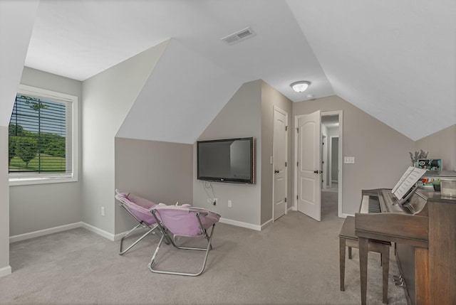 carpeted office with vaulted ceiling