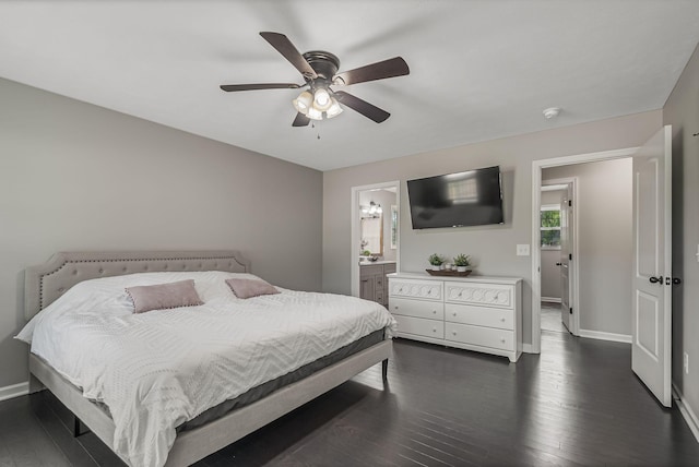 bedroom featuring ceiling fan, dark wood-type flooring, and connected bathroom