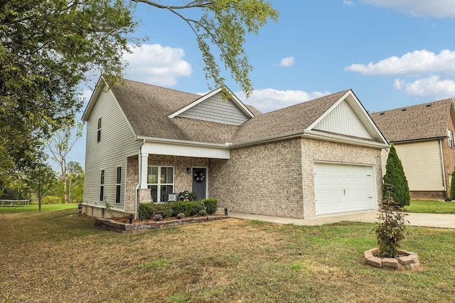 view of front of home with a front lawn, a garage, and covered porch