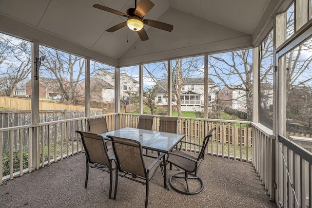 sunroom featuring ceiling fan and lofted ceiling