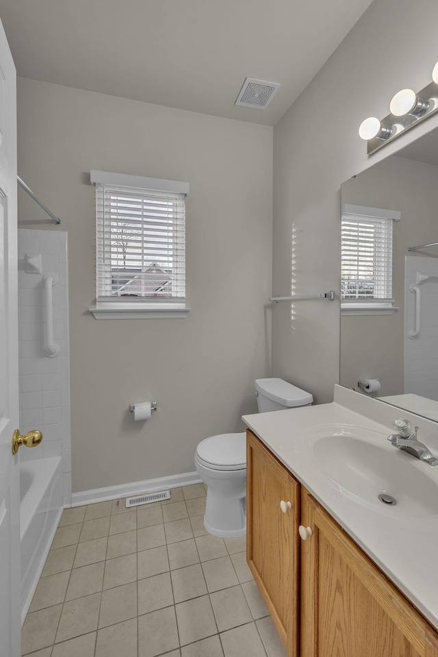 full bathroom with toilet, tile patterned floors, vanity, and bathtub / shower combination