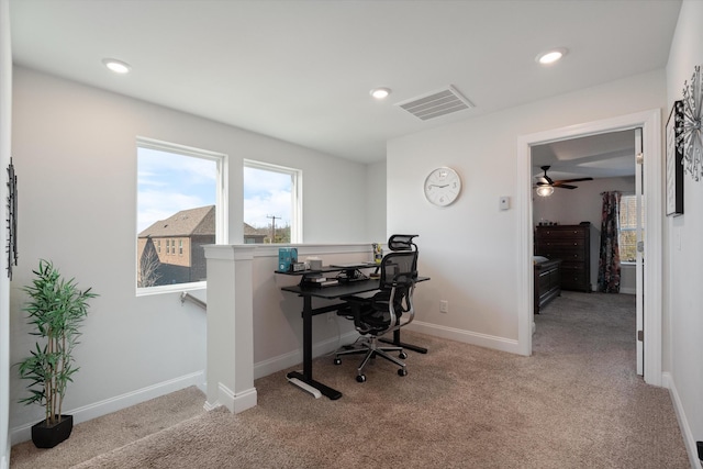 carpeted office with ceiling fan