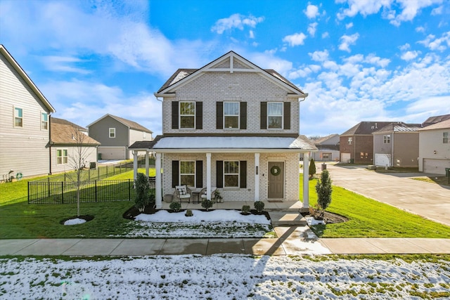 view of front of home with a porch and a yard