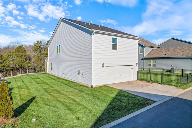 view of property exterior with a garage and a yard