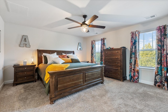 bedroom with light carpet and ceiling fan