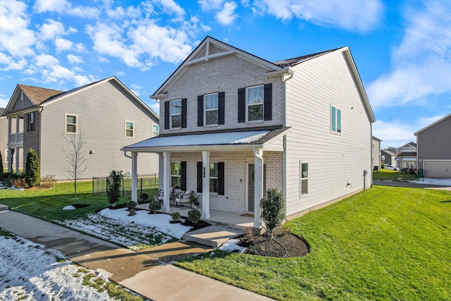 view of front of property featuring a front lawn and a porch