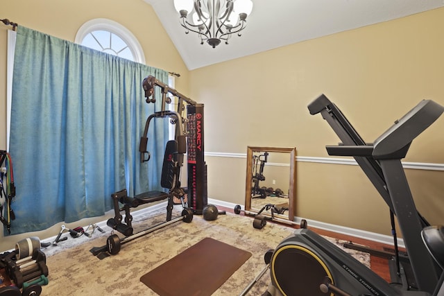 exercise area featuring a chandelier and lofted ceiling