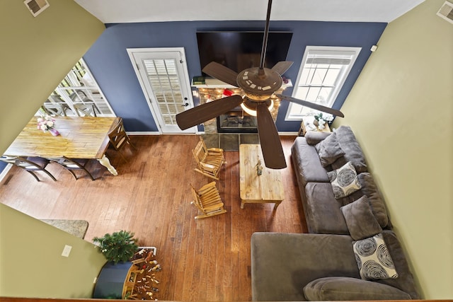 living room with ceiling fan and wood-type flooring