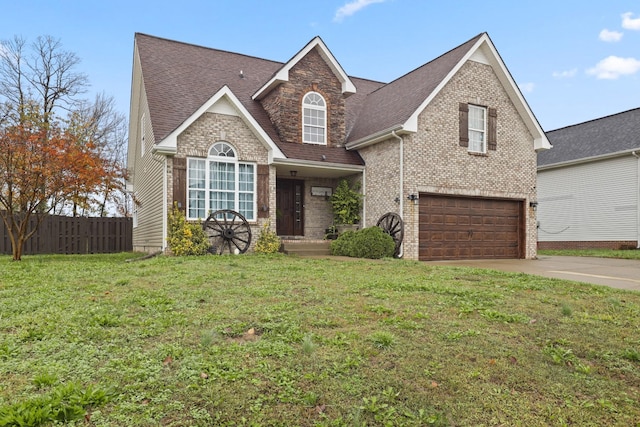 view of front of house featuring a front yard and a garage