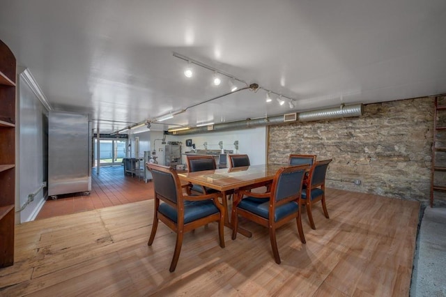 dining room with light hardwood / wood-style flooring