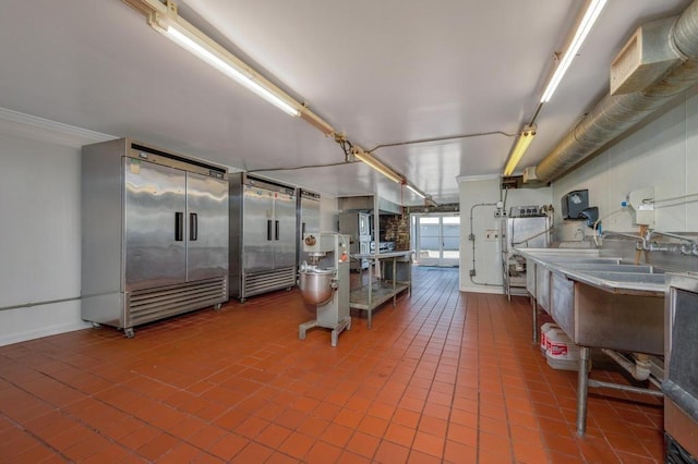 interior space featuring tile patterned floors and stainless steel built in refrigerator