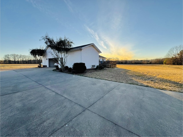 property exterior at dusk with a garage