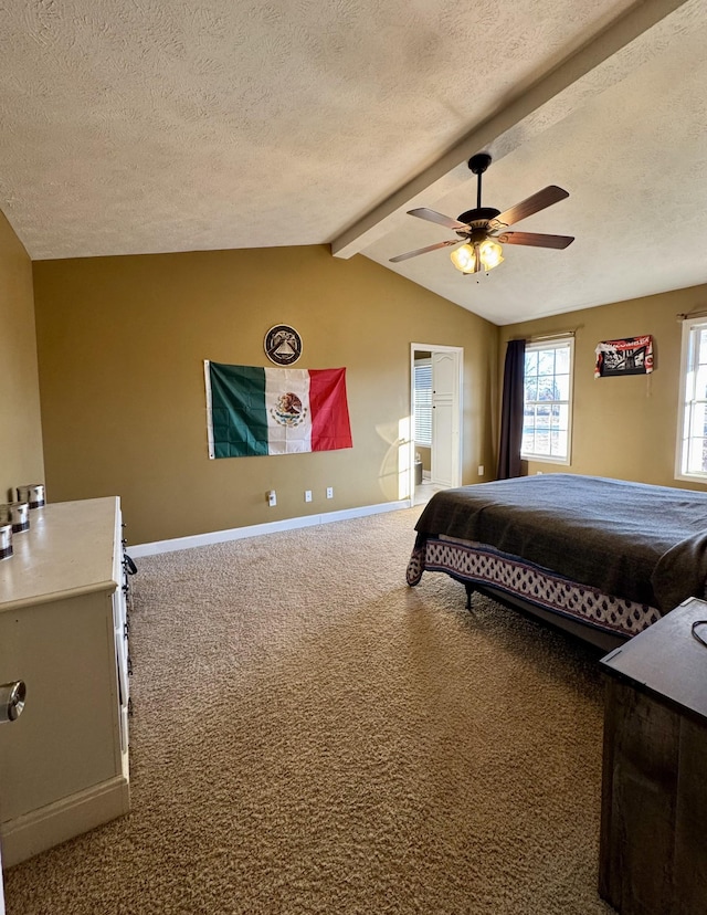 bedroom with ceiling fan, a textured ceiling, lofted ceiling with beams, and carpet flooring