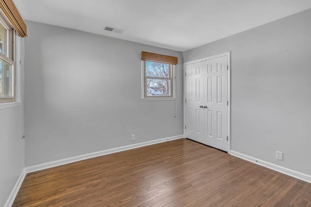 spare room featuring hardwood / wood-style flooring