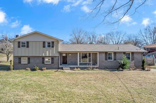 split level home featuring a front lawn