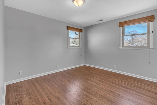 empty room featuring hardwood / wood-style flooring