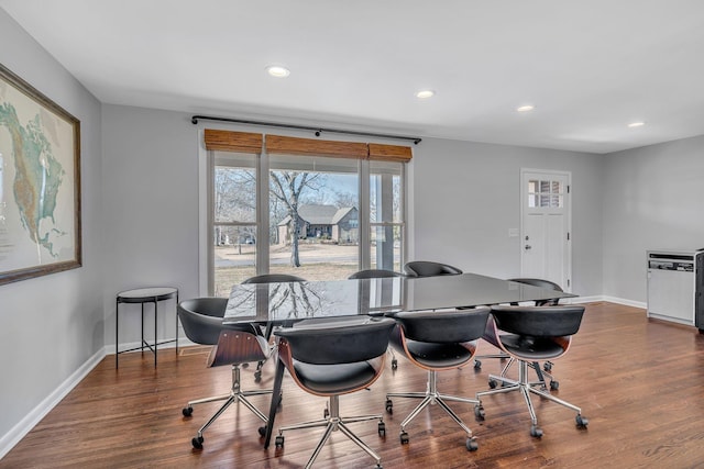 dining area featuring dark hardwood / wood-style floors