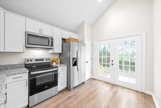 kitchen featuring white cabinets, appliances with stainless steel finishes, and french doors