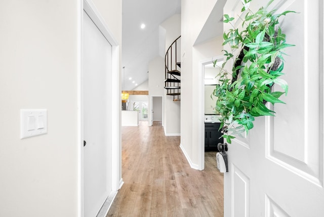 hallway with light hardwood / wood-style floors