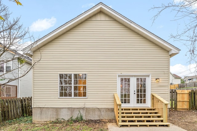 rear view of property featuring french doors