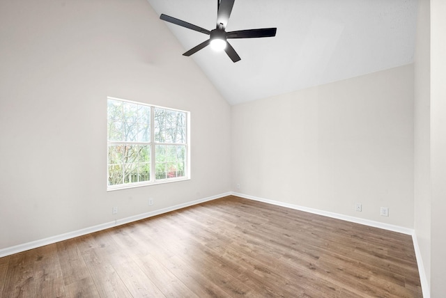 unfurnished room featuring high vaulted ceiling, ceiling fan, and hardwood / wood-style flooring