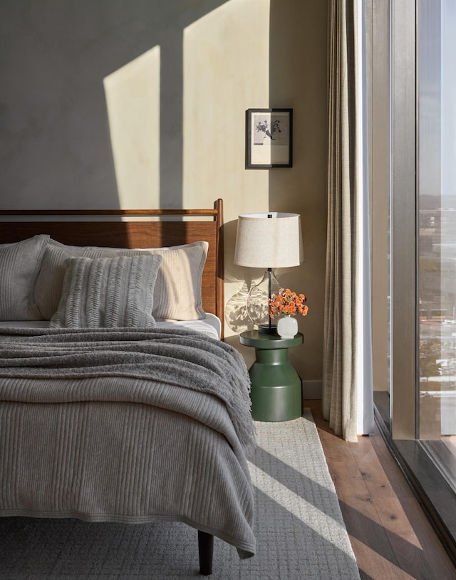 bedroom with hardwood / wood-style flooring