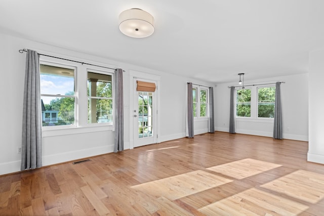 spare room featuring light wood-type flooring