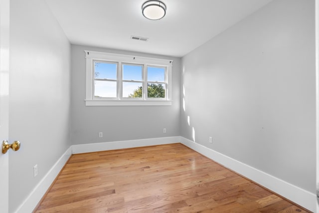 spare room with light hardwood / wood-style floors