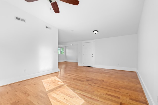 empty room featuring ceiling fan, wood-type flooring, and lofted ceiling