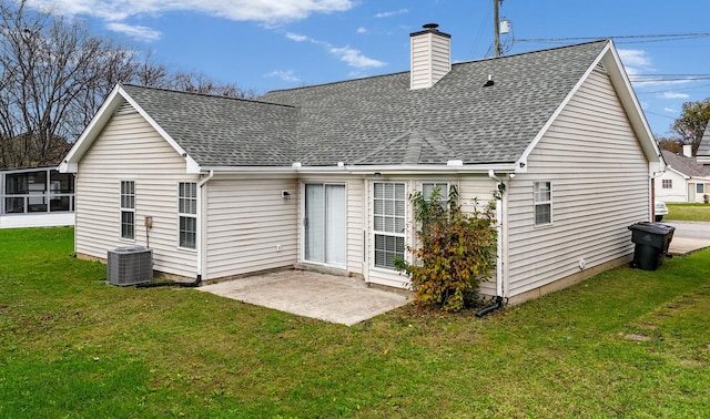 back of house featuring central air condition unit, a yard, and a patio