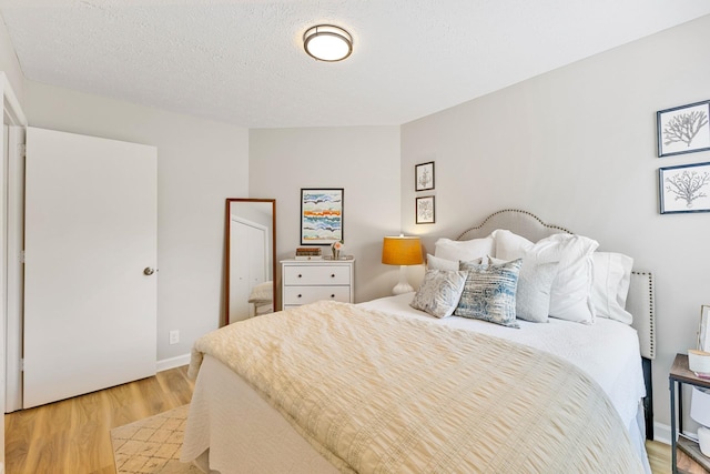 bedroom featuring light hardwood / wood-style floors